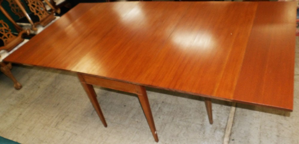 Mahogany Drop Leaf Dining Table: Mahogany Drop Leaf Dining Table. 30 1/4" H 48" W 25 3/4" D "ALL DESCRIPTIONS AND ANY CONDITION STATEMENT GIVEN BY LANGSTON AUCTION GALLERY ARE STRICTLY OPINIONS AND LANGSTON'S SHALL HAVE NO RESPONSIBI