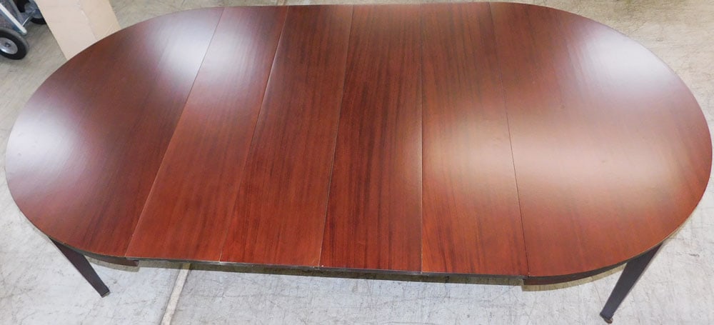 Round Mahogany Dining Table with Four Leaves Labeled NY: Round Mahogany Dining Table with Four Leaves Labeled NY. 29 1/2" H 105" W 55" D "ALL DESCRIPTIONS AND ANY CONDITION STATEMENT GIVEN BY LANGSTON AUCTION GALLERY ARE STRICTLY OPINIONS AND LANGSTON'S