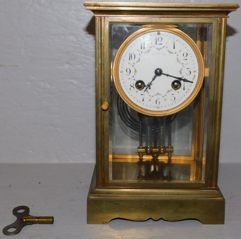 Brass & Glass Crystal Regulator by Tiffany & Co.: Brass & Glass Crystal Regulator by Tiffany & Co. . 9" H 6" W 4 1/2" D "ALL DESCRIPTIONS AND ANY CONDITION STATEMENT GIVEN BY LANGSTON AUCTION GALLERY ARE STRICTLY OPINIONS AND LANGSTON'S SHALL HAVE NO