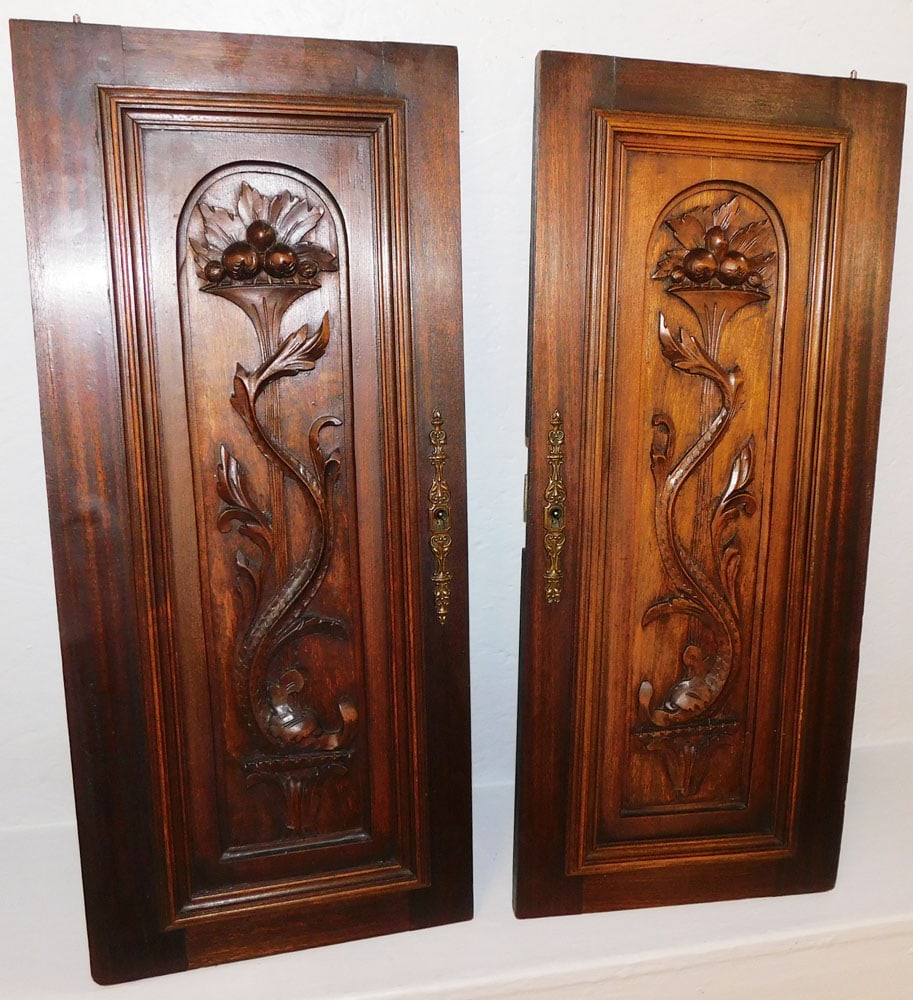 Pair of Antique Carved Walnut Door Panels: Pair of Antique Carved Walnut Door Panels. 26 3/4" x 11 1/2" "ALL DESCRIPTIONS AND ANY CONDITION STATEMENT GIVEN BY LANGSTON AUCTION GALLERY ARE STRICTLY OPINIONS AND LANGSTON'S SHALL HAVE NO RESPONSI