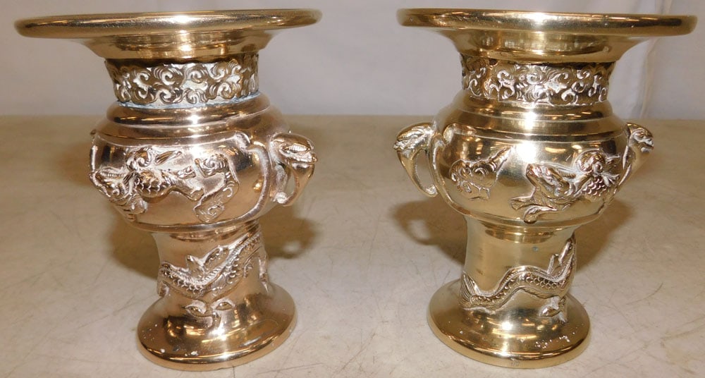 Pair of Oriental Polished Brass Urns: Pair of Oriental Polished Brass Urns . 5" H 4" Dia. "ALL DESCRIPTIONS AND ANY CONDITION STATEMENT GIVEN BY LANGSTON AUCTION GALLERY ARE STRICTLY OPINIONS AND LANGSTON'S SHALL HAVE NO RESPONSIBILITY