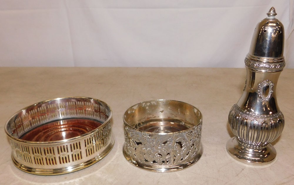 Two Silverplated Wine Coasters & Muffineer: Two Silverplated Wine Coasters & Muffineer . Up to 7 1/4" H 2 1/2" Dia. "ALL DESCRIPTIONS AND ANY CONDITION STATEMENT GIVEN BY LANGSTON AUCTION GALLERY ARE STRICTLY OPINIONS AND LANGSTON'S SHALL HAVE