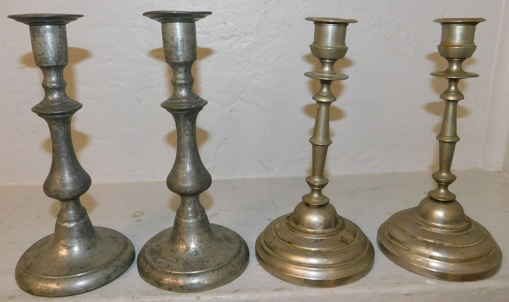 Two Pair of Pewter Candlesticks: Two Pair of Pewter Candlesticks . Up to 8" H 3 3/4" Dia. "ALL DESCRIPTIONS AND ANY CONDITION STATEMENT GIVEN BY LANGSTON AUCTION GALLERY ARE STRICTLY OPINIONS AND LANGSTON'S SHALL HAVE NO