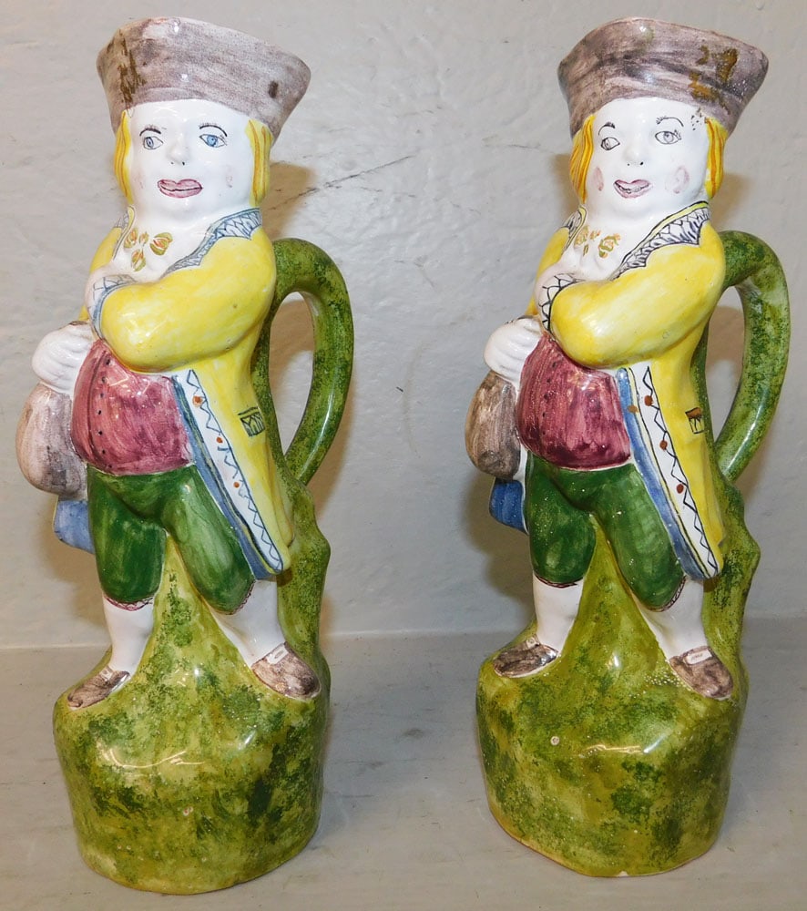 Pair of Painted Pottery Figural Toby Mugs: Pair of Painted Pottery Figural Toby Mugs . 9 1/2" H 5" W "ALL DESCRIPTIONS AND ANY CONDITION STATEMENT GIVEN BY LANGSTON AUCTION GALLERY ARE STRICTLY OPINIONS AND LANGSTON'S SHALL HAVE NO