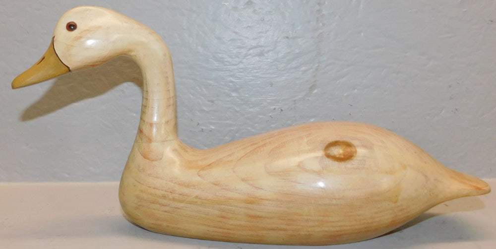 Carved Pine Swan Decoy: Carved Pine Swan Decoy . 7 1/2" H 15 1/4" L "ALL DESCRIPTIONS AND ANY CONDITION STATEMENT GIVEN BY LANGSTON AUCTION GALLERY ARE STRICTLY OPINIONS AND LANGSTON'S SHALL HAVE NO RESPONSIBILITY FOR