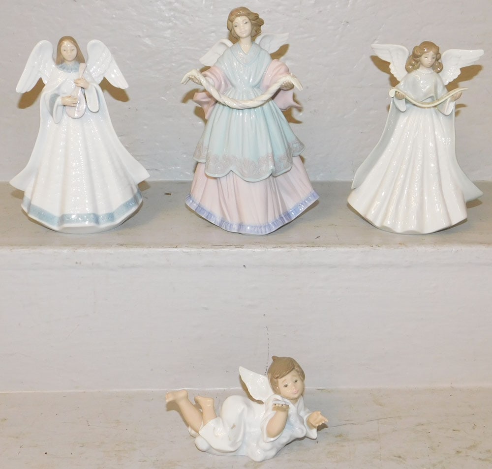 Four Lladro Figurines: Four Lladro Figurines . 8 1/4" H 5" W "ALL DESCRIPTIONS AND ANY CONDITION STATEMENT GIVEN BY LANGSTON AUCTION GALLERY ARE STRICTLY OPINIONS AND LANGSTON'S SHALL HAVE NO RESPONSIBILITY FOR ERRORS OR OM