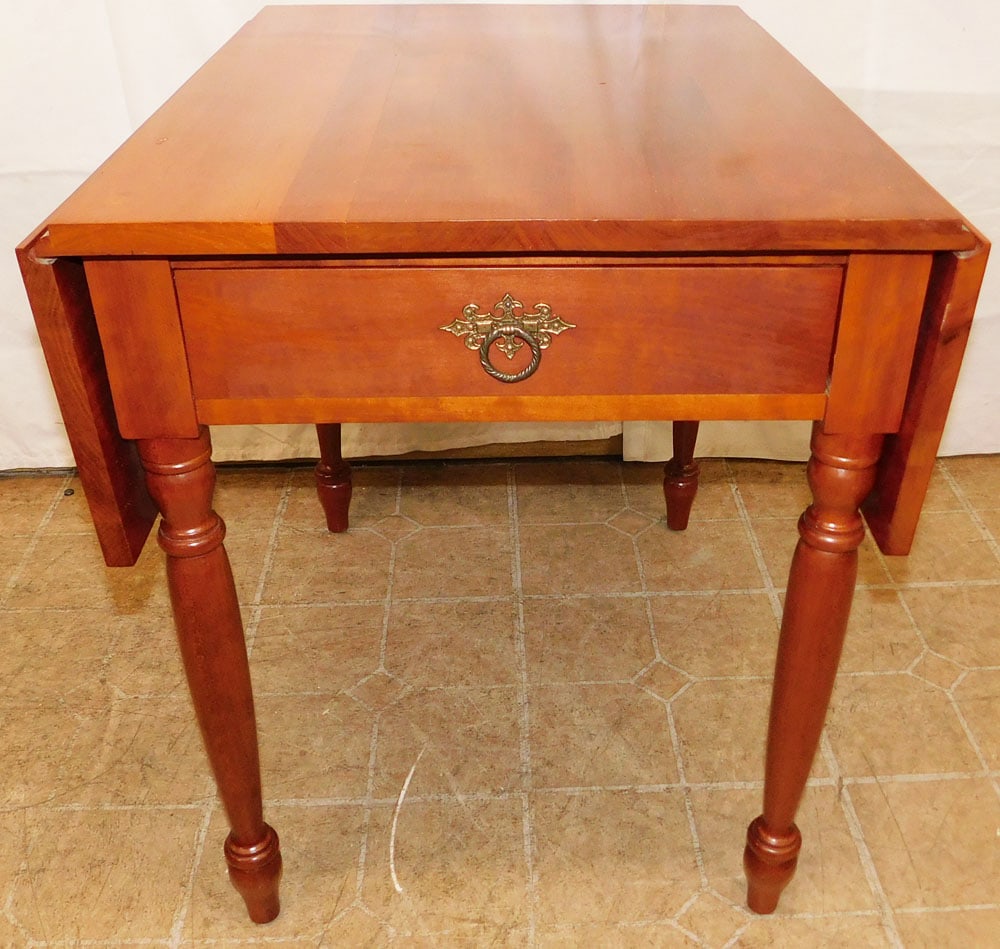 Cherry One Drawer Drop Leaf End Table: Cherry One Drawer Drop Leaf End Table . 25" H 20 3/4" W 26 1/2" D "ALL DESCRIPTIONS AND ANY CONDITION STATEMENT GIVEN BY LANGSTON AUCTION GALLERY ARE STRICTLY OPINIONS AND LANGSTON'S SHALL HAVE NO