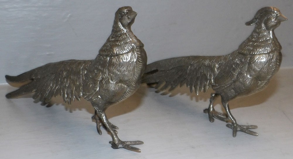 Pair of Silverplated Pheasants: Pair of Silverplated Pheasants . 5" H 11" L "ALL DESCRIPTIONS AND ANY CONDITION STATEMENT GIVEN BY LANGSTON AUCTION GALLERY ARE STRICTLY OPINIONS AND LANGSTON'S SHALL HAVE NO RESPONSIBILITY FOR ERRORS
