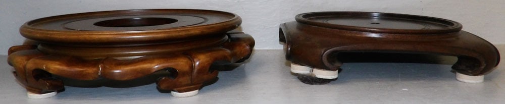 Two Oriental Teak Wood Stands: Two Oriental Teak Wood Stands . 3" H 13" Dia. "ALL DESCRIPTIONS AND ANY CONDITION STATEMENT GIVEN BY LANGSTON AUCTION GALLERY ARE STRICTLY OPINIONS AND LANGSTON'S SHALL HAVE NO RESPONSIBILITY FOR ERRO