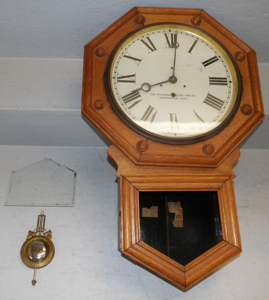 Antique Oak School House Regulator: Antique Oak School House Regulator. 26 1/2" H 17" W "ALL DESCRIPTIONS AND ANY CONDITION STATEMENT GIVEN BY LANGSTON AUCTION GALLERY ARE STRICTLY OPINIONS AND LANGSTON'S SHALL HAVE NO RESPONSIBILITY
