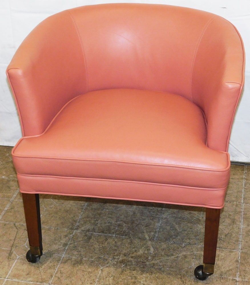 Mid Century Modern Rose Pink Leather Upholstered Regency Tub Chair on Casters: Mid Century Modern Rose Pink Leather Upholstered Regency Tub Chair on Casters. 29 1/2" H 28 1/2" W 26" D "ALL DESCRIPTIONS AND ANY CONDITION STATEMENT GIVEN BY LANGSTON AUCTION GALLERY ARE STRICTLY OP