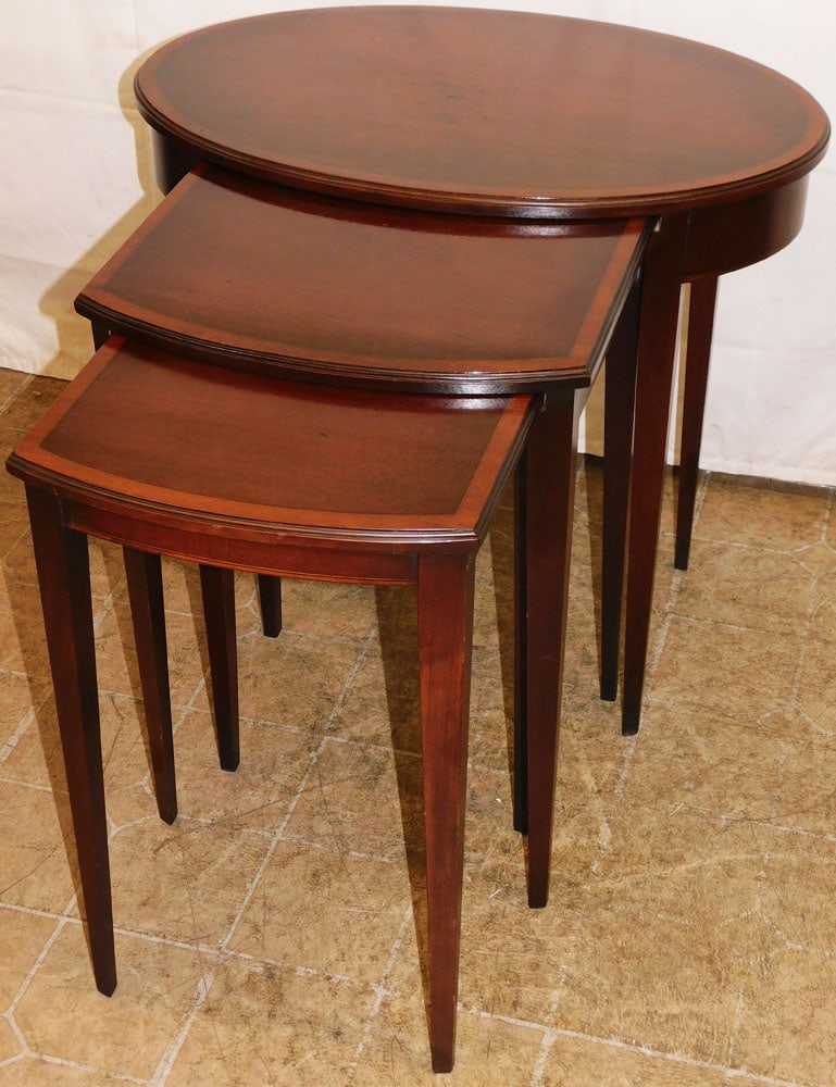 Set of Three Mahogany Banded Top Nesting Tables with Oval Form Master: Set of Three Mahogany Banded Top Nesting Tables with Oval Form Master. Up to 24 1/4" H 25 1/2" W 18" D "ALL DESCRIPTIONS AND ANY CONDITION STATEMENT GIVEN BY LANGSTON AUCTION GALLERY ARE STRICTLY