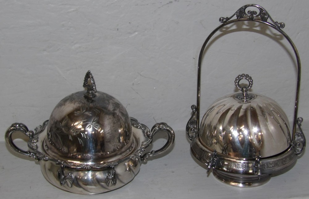 Two Antique Silverplated Victorian Butter Dishes: Two Antique Silverplated Victorian Butter Dishes. Up to 10" H 6 1/2" W "ALL DESCRIPTIONS AND ANY CONDITION STATEMENT GIVEN BY LANGSTON AUCTION GALLERY ARE STRICTLY OPINIONS AND LANGSTON'S SHALL HAVE N