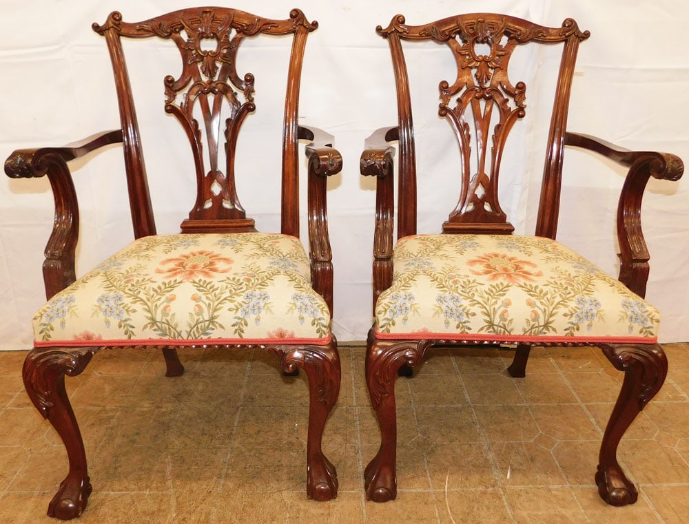 Pair of Carved Mahogany Chippendale Style Arm Chairs with Claw Feet: Pair of Carved Mahogany Chippendale Style Arm Chairs with Claw Feet. 38 1/2" H 23 1/2" W 21" D "ALL DESCRIPTIONS AND ANY CONDITION STATEMENT GIVEN BY LANGSTON AUCTION GALLERY ARE STRICTLY OPINIONS AND