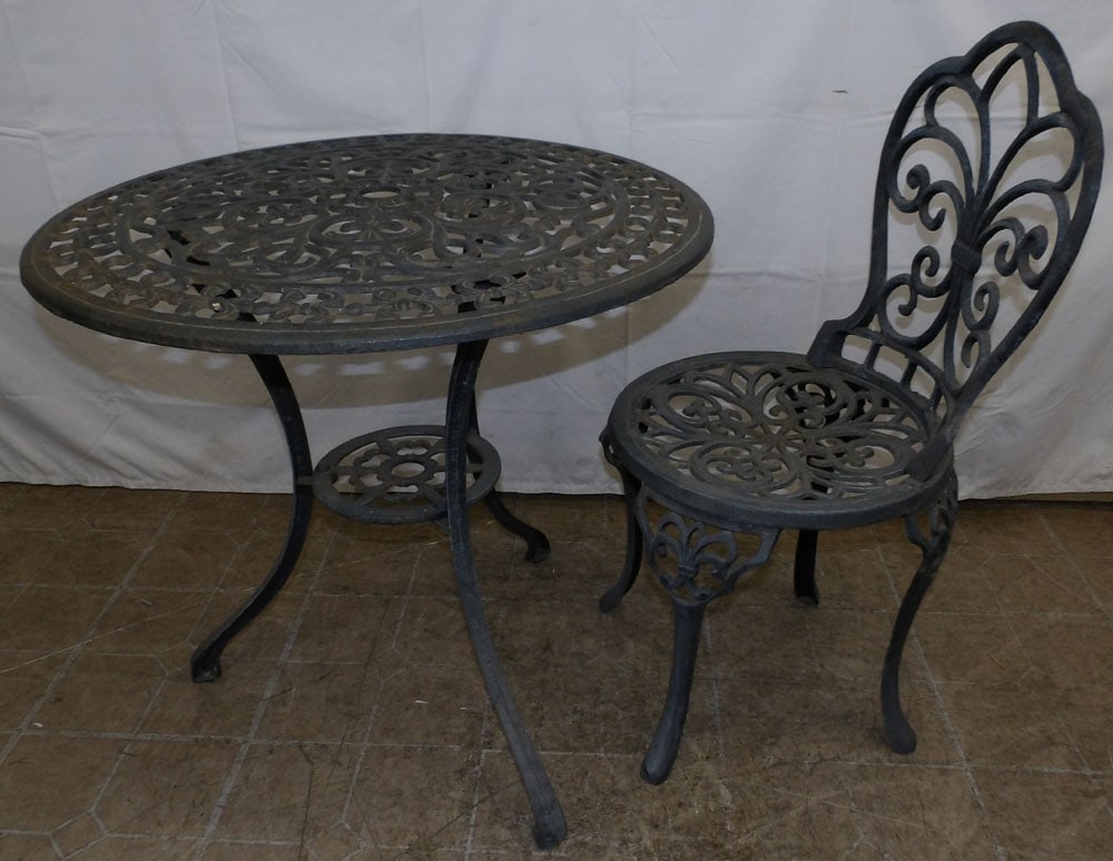 Painted Cast Iron Outdoor Table with Chair: Painted Cast Iron Outdoor Table with Chair. Up to 26 1/4" H 27 3/4" Dia. "ALL DESCRIPTIONS AND ANY CONDITION STATEMENT GIVEN BY LANGSTON AUCTION GALLERY ARE STRICTLY OPINIONS AND LANGSTON'S SHALL