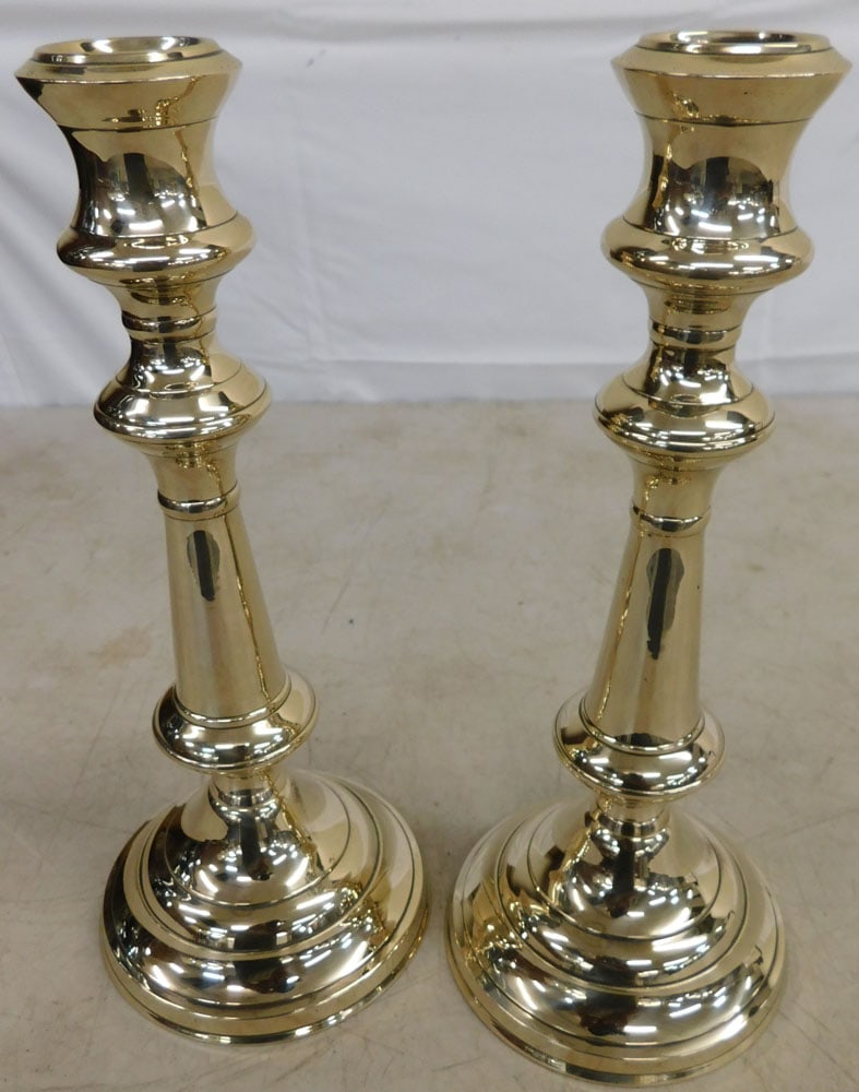 Pair of Polished Round Base Candlesticks: Pair of Polished Round Base Candlesticks . 10 1/2" H 4 1/2" Dia. "ALL DESCRIPTIONS AND ANY CONDITION STATEMENT GIVEN BY LANGSTON AUCTION GALLERY ARE STRICTLY OPINIONS AND LANGSTON'S SHALL HAVE NO