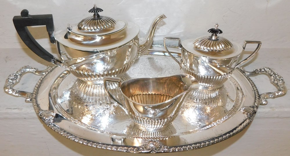 Four Piece Silverplate Tea Service: Four Piece Silverplate Tea Service . Up to 21" x 12 3/4" "ALL DESCRIPTIONS AND ANY CONDITION STATEMENT GIVEN BY LANGSTON AUCTION GALLERY ARE STRICTLY OPINIONS AND LANGSTON'S SHALL HAVE NO