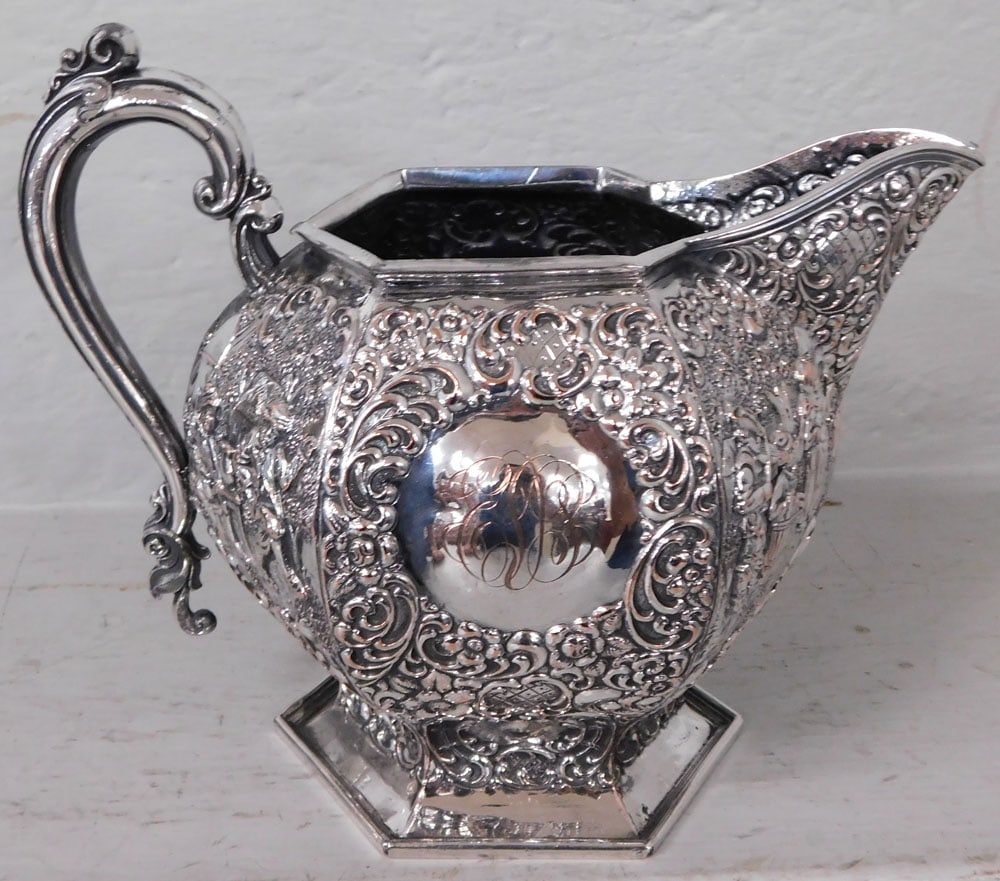 Dutch Silver on Copper Embossed Pitcher: Dutch Silver on Copper Embossed Pitcher . 7 1/2" H 9" W "ALL DESCRIPTIONS AND ANY CONDITION STATEMENT GIVEN BY LANGSTON AUCTION GALLERY ARE STRICTLY OPINIONS AND LANGSTON'S SHALL HAVE NO