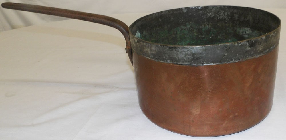 Antique Copper Pot with Wrought Iron Handle: Antique Copper Pot with Wrought Iron Handle . 8" H 20 3/4" L "ALL DESCRIPTIONS AND ANY CONDITION STATEMENT GIVEN BY LANGSTON AUCTION GALLERY ARE STRICTLY OPINIONS AND LANGSTON'S SHALL HAVE NO