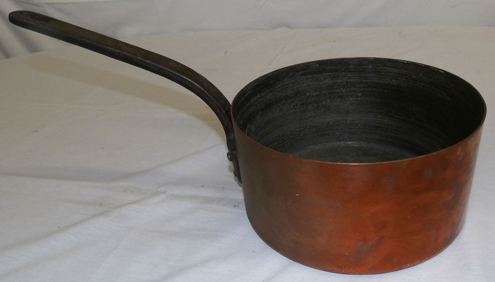 Antique Copper Pot with Wrought Iron Handle: Antique Copper Pot with Wrought Iron Handle . 8 3/4" H 18 3/4" L "ALL DESCRIPTIONS AND ANY CONDITION STATEMENT GIVEN BY LANGSTON AUCTION GALLERY ARE STRICTLY OPINIONS AND LANGSTON'S SHALL HAVE NO