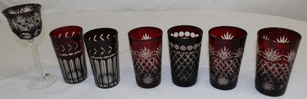 Six Ruby Cut to Clear Tumblers & One Goblet, (Small Chip): Six Ruby Cut to Clear Tumblers & One Goblet, (Small Chip). Up to 8 1/4" H 3 1/2" Dia. "ALL DESCRIPTIONS AND ANY CONDITION STATEMENT GIVEN BY LANGSTON AUCTION GALLERY ARE STRICTLY OPINIONS AND LANGSTON