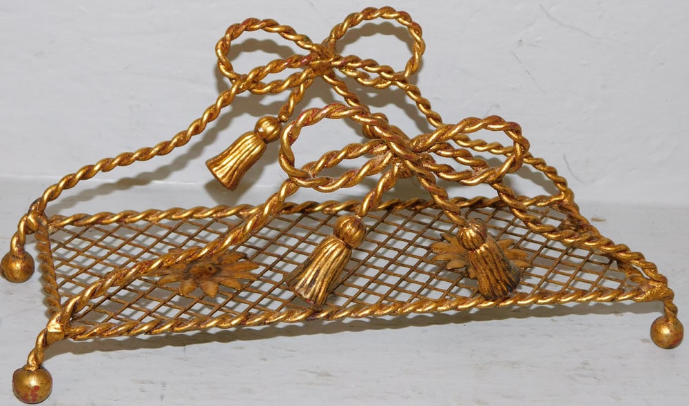 Gilded Metal Regency Style Twisted Rope Napkin Holder with Tassel Accents: Gilded Metal Regency Style Twisted Rope Napkin Holder with Tassel Accents. 4 1/2" H 11" W 4" D "ALL DESCRIPTIONS AND ANY CONDITION STATEMENT GIVEN BY LANGSTON AUCTION GALLERY ARE STRICTLY OPINIONS