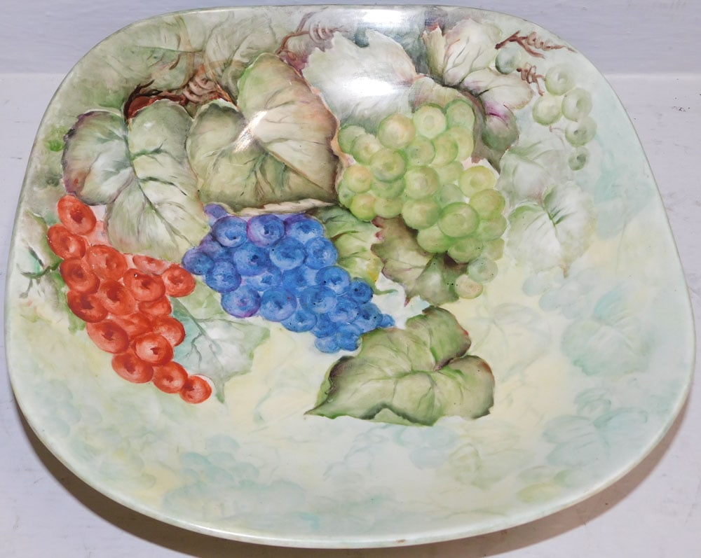 Unsigned Hand Painted Limoges Porcelain Center Bowl with Grape Motif: Unsigned Hand Painted Limoges Porcelain Center Bowl with Grape Motif . 3 1/4" H 14" Dia. "ALL DESCRIPTIONS AND ANY CONDITION STATEMENT GIVEN BY LANGSTON AUCTION GALLERY ARE STRICTLY OPINIONS AND