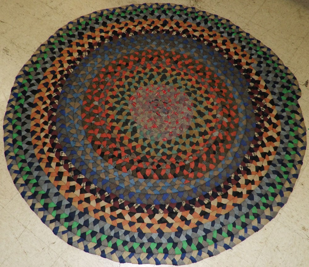 Round Mid Century Folk Art Muti Color Hand Braided Rug: Round Mid Century Folk Art Muti Color Hand Braided Rug. Up to 54" Dia. "ALL DESCRIPTIONS AND ANY CONDITION STATEMENT GIVEN BY LANGSTON AUCTION GALLERY ARE STRICTLY OPINIONS AND LANGSTON'S SHALL HAVE