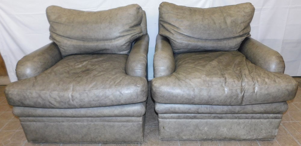 Pair of Oversized Leather Swivel Arm Chairs by Tomlinson: Pair of Oversized Leather Swivel Arm Chairs by Tomlinson. 35" H 39" W 36" D "ALL DESCRIPTIONS AND ANY CONDITION STATEMENT GIVEN BY LANGSTON AUCTION GALLERY ARE STRICTLY OPINIONS AND LANGSTON'S SHALL