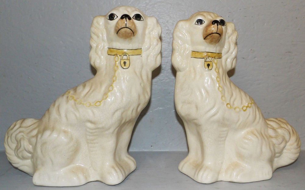 Pair of Staffordshire Style Spaniels: Pair of Staffordshire Style Spaniels . 11 1/2" H 9 1/2" W "ALL DESCRIPTIONS AND ANY CONDITION STATEMENT GIVEN BY LANGSTON AUCTION GALLERY ARE STRICTLY OPINIONS AND LANGSTON'S SHALL HAVE NO