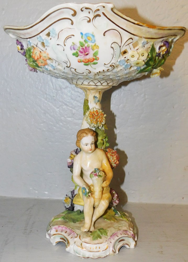 Hand Painted Porcelain Dresden Figural Compote, (Has Restoration): Hand Painted Porcelain Dresden Figural Compote, (Has Restoration). 12 1/2" H 10" W 9" D "ALL DESCRIPTIONS AND ANY CONDITION STATEMENT GIVEN BY LANGSTON AUCTION GALLERY ARE STRICTLY OPINIONS AND