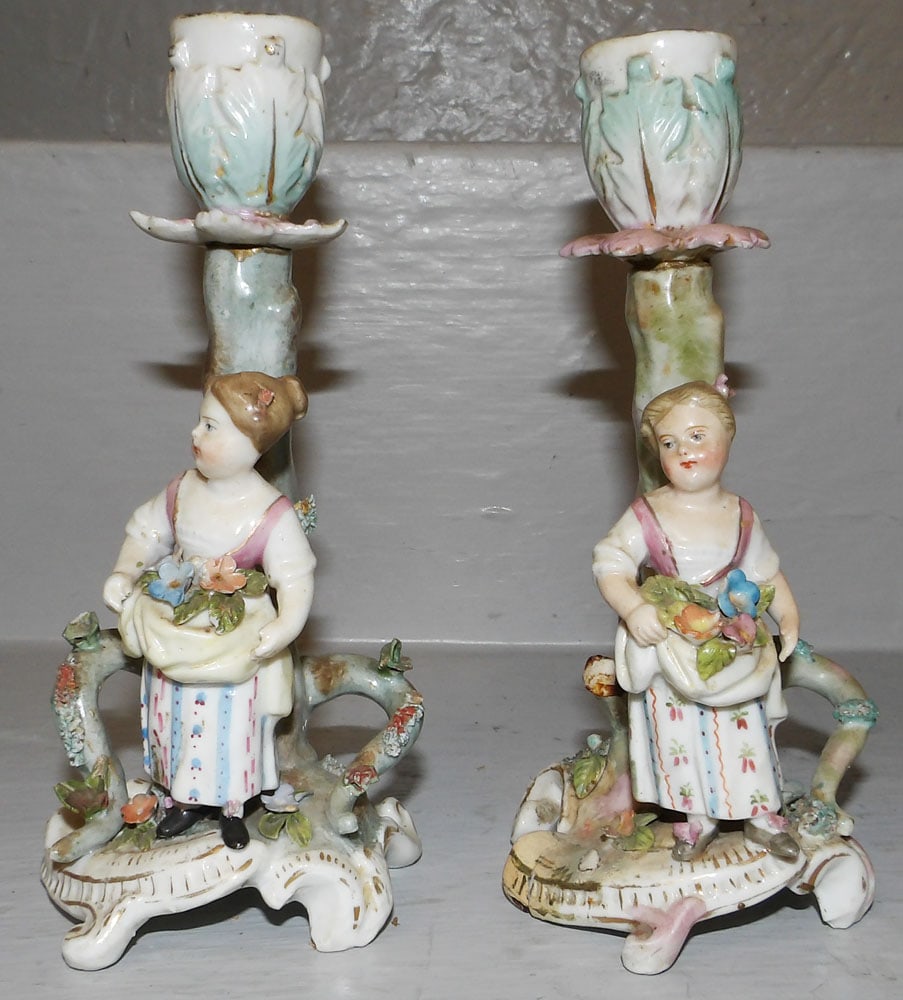 Pair of Painted Porcelain German Figural Candlesticks: Pair of Painted Porcelain German Figural Candlesticks . 6 1/4" H 3" W "ALL DESCRIPTIONS AND ANY CONDITION STATEMENT GIVEN BY LANGSTON AUCTION GALLERY ARE STRICTLY OPINIONS AND LANGSTON'S SHALL HAVE