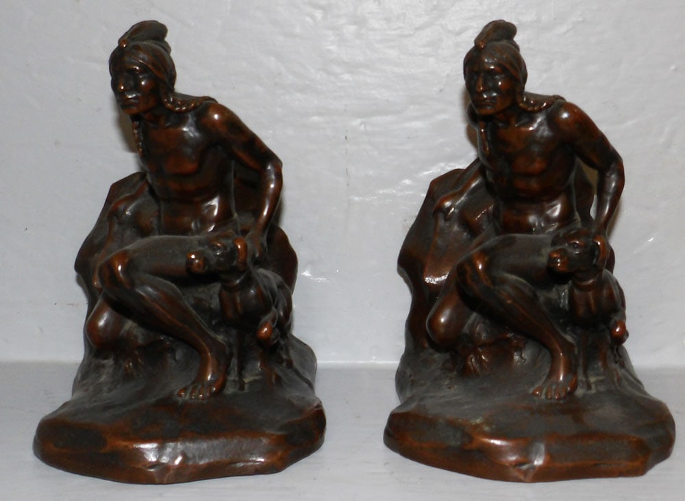 Pair of Spelter Native American Bookends Marked C. Yieth: Pair of Spelter Native American Bookends Marked C. Yieth. 6 1/4" H 5 1/4" W 4 1/4" D "ALL DESCRIPTIONS AND ANY CONDITION STATEMENT GIVEN BY LANGSTON AUCTION GALLERY ARE STRICTLY OPINIONS AND