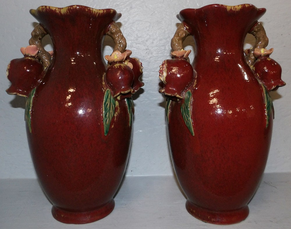 Pair of Ox Blood Oriental Pottery Vases with Pomegranate Handles: Pair of Ox Blood Oriental Pottery Vases with Pomegranate Handles . 12 3/4" H 8 1/2" W "ALL DESCRIPTIONS AND ANY CONDITION STATEMENT GIVEN BY LANGSTON AUCTION GALLERY ARE STRICTLY OPINIONS AND