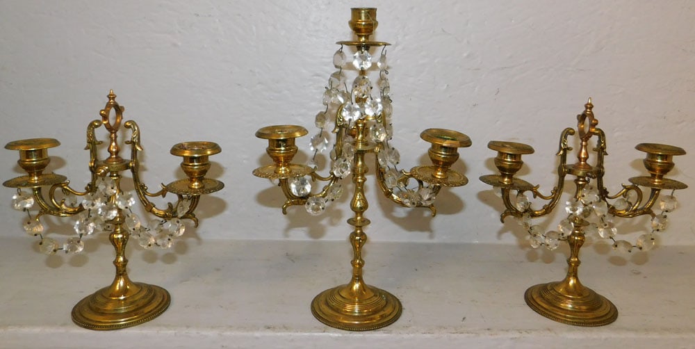 Three Piece Brass & Crystal Candelabra Console Set: Three Piece Brass & Crystal Candelabra Console Set . Up to 11 1/2" H 7 3/4" Dia. "ALL DESCRIPTIONS AND ANY CONDITION STATEMENT GIVEN BY LANGSTON AUCTION GALLERY ARE STRICTLY OPINIONS AND LANGSTON'S