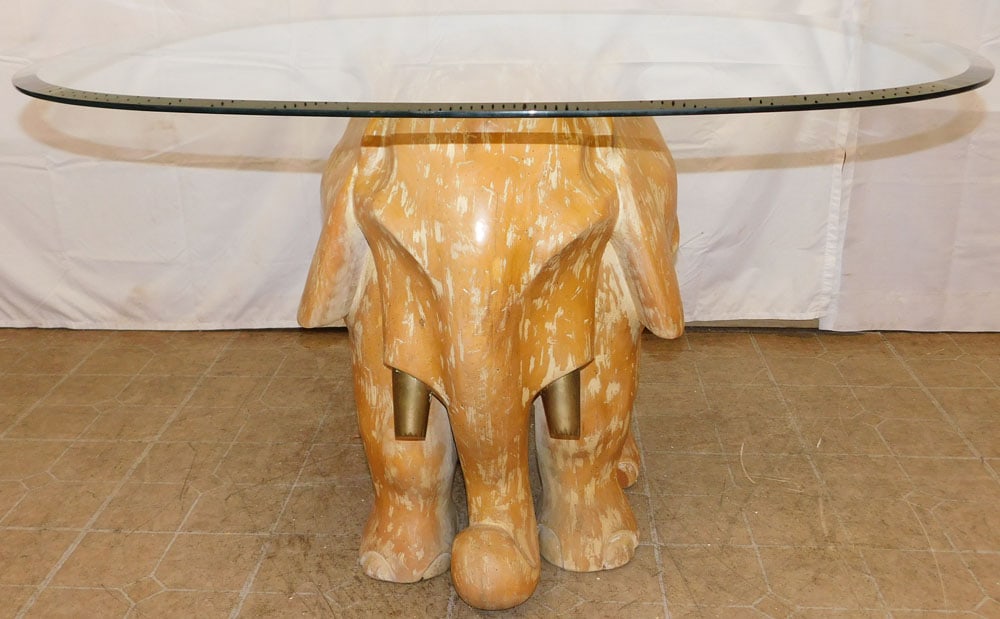 Mid Century Modern Carved Pine & Brass Elephant Form Center Table with Glass Top: Mid Century Modern Carved Pine & Brass Elephant Form Center Table with Glass Top. 29 1/2" H 44 3/4" Dia. "ALL DESCRIPTIONS AND ANY CONDITION STATEMENT GIVEN BY LANGSTON AUCTION GALLERY ARE STRICTLY