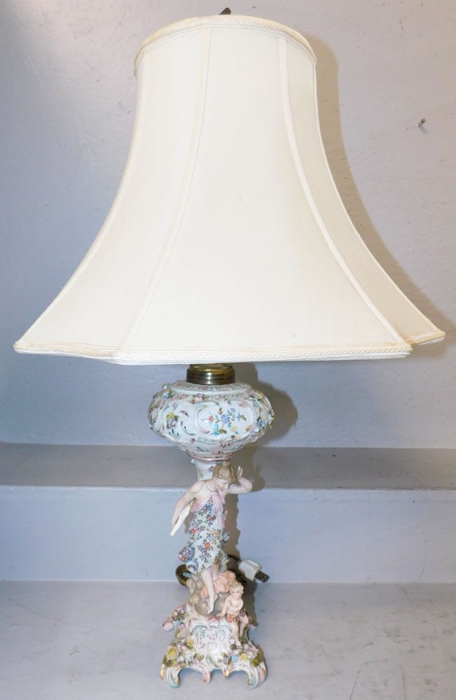 Antique Painted Porcelain Oil Lamp Electrified, Has Restoration: Antique Painted Porcelain Oil Lamp Electrified, Has Restoration. 31" H 17" W 17 1/2" D "ALL DESCRIPTIONS AND ANY CONDITION STATEMENT GIVEN BY LANGSTON AUCTION GALLERY ARE STRICTLY OPINIONS AND