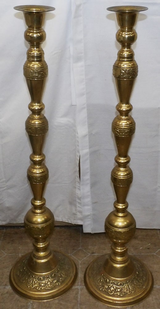 Pair of Large Brass Oriental Candlesticks: Pair of Large Brass Oriental Candlesticks . 34 1/4" H 9 1/4" Dia. "ALL DESCRIPTIONS AND ANY CONDITION STATEMENT GIVEN BY LANGSTON AUCTION GALLERY ARE STRICTLY OPINIONS AND LANGSTON'S SHALL HAVE NO