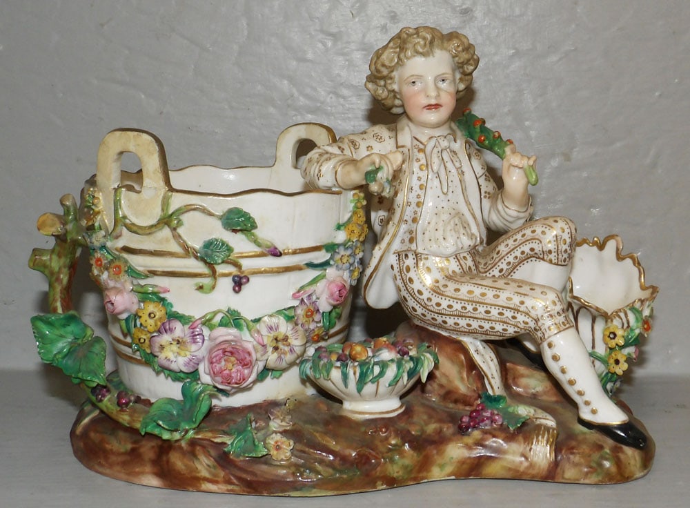 Antique Hand Painted German Figural Planter, (Has Restoration): Antique Hand Painted German Figural Planter, (Has Restoration). 6 3/4" H 9" W "ALL DESCRIPTIONS AND ANY CONDITION STATEMENT GIVEN BY LANGSTON AUCTION GALLERY ARE STRICTLY OPINIONS AND LANGSTON'S
