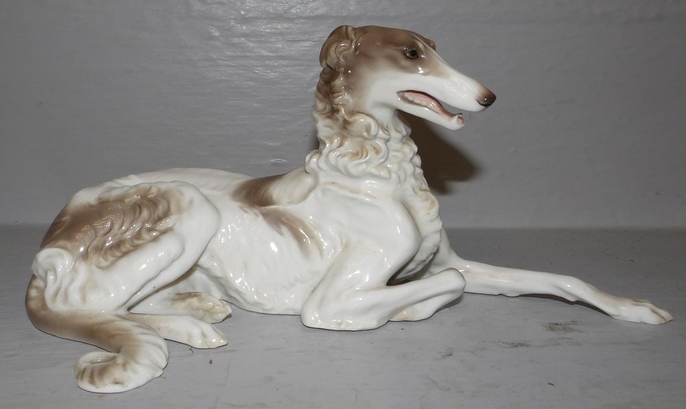 Painted Porcelain Whippet: Painted Porcelain Whippet . 5" H 10 3/4" W "ALL DESCRIPTIONS AND ANY CONDITION STATEMENT GIVEN BY LANGSTON AUCTION GALLERY ARE STRICTLY OPINIONS AND LANGSTON'S SHALL HAVE NO RESPONSIBILITY FOR ERRORS