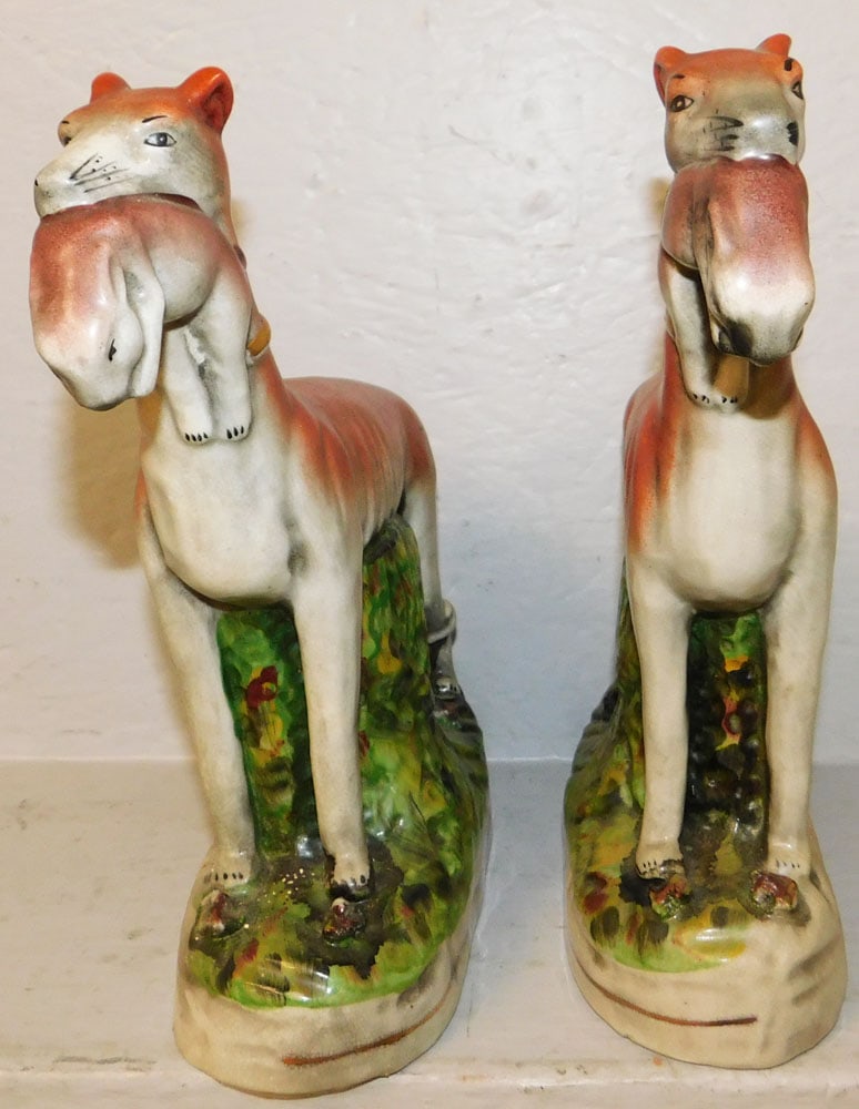 Pair of Painted Porcelain Whippet Figures: Pair of Painted Porcelain Whippet Figures. 11 1/4" H 10 3/4" W "ALL DESCRIPTIONS AND ANY CONDITION STATEMENT GIVEN BY LANGSTON AUCTION GALLERY ARE STRICTLY OPINIONS AND LANGSTON'S SHALL HAVE NO RESPON