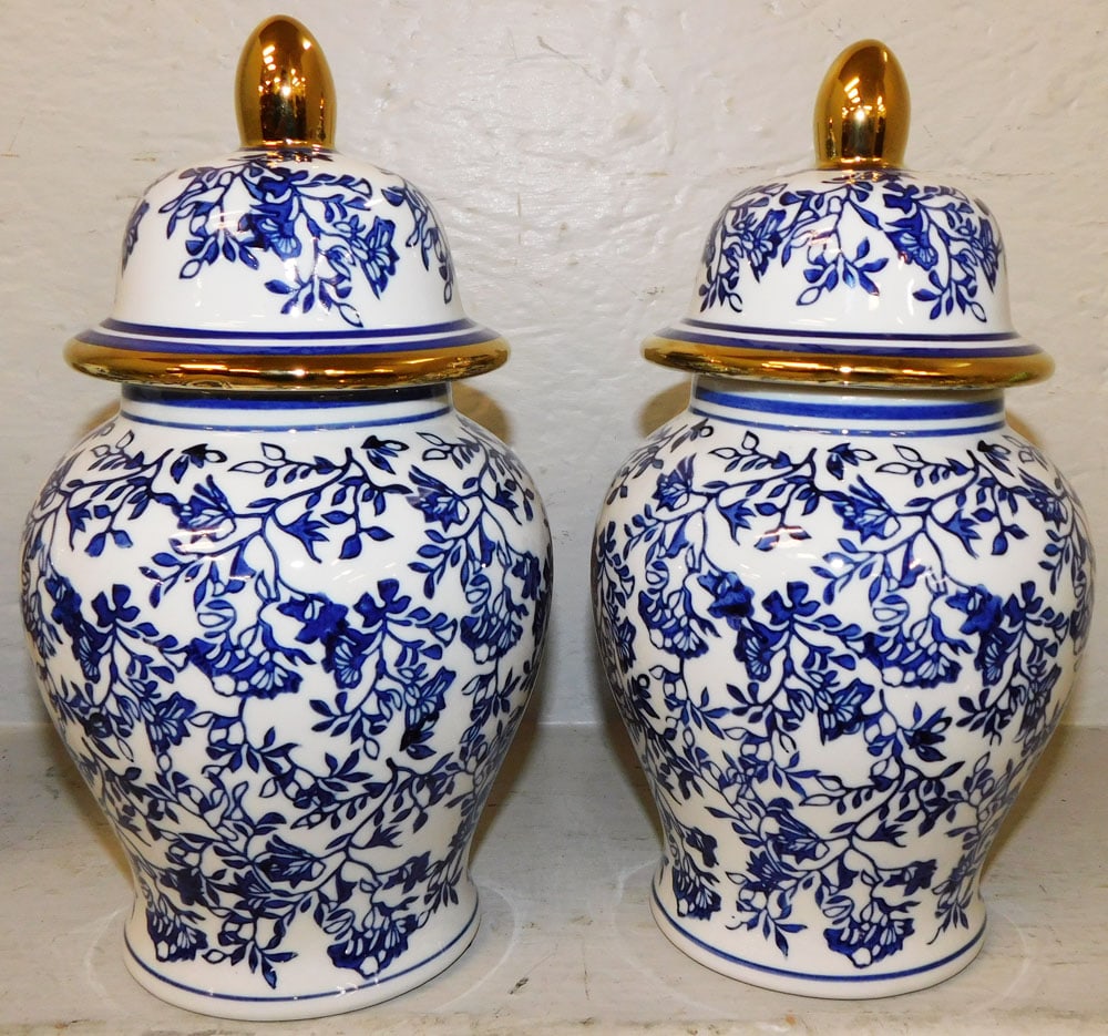 Pair of Oriental Blue & White Porcelain Covered Urns: Pair of Oriental Blue & White Porcelain Covered Urns . 10 1/2" H 5 3/4" Dia. "ALL DESCRIPTIONS AND ANY CONDITION STATEMENT GIVEN BY LANGSTON AUCTION GALLERY ARE STRICTLY OPINIONS AND LANGSTON'S SHALL