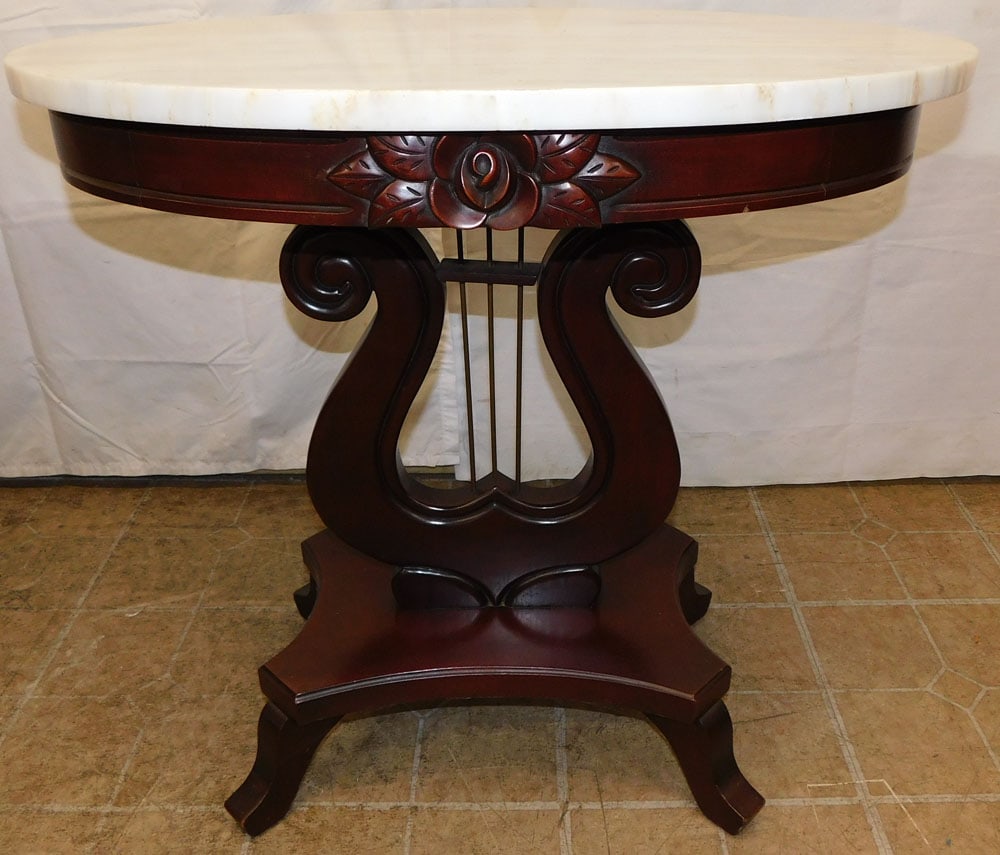 Oval Mahogany Victorian Style Marble Top Lamp Table: Oval Mahogany Victorian Style Marble Top Lamp Table. 28" H 29 1/2" W 19 1/2" D "ALL DESCRIPTIONS AND ANY CONDITION STATEMENT GIVEN BY LANGSTON AUCTION GALLERY ARE STRICTLY OPINIONS AND LANGSTON'S