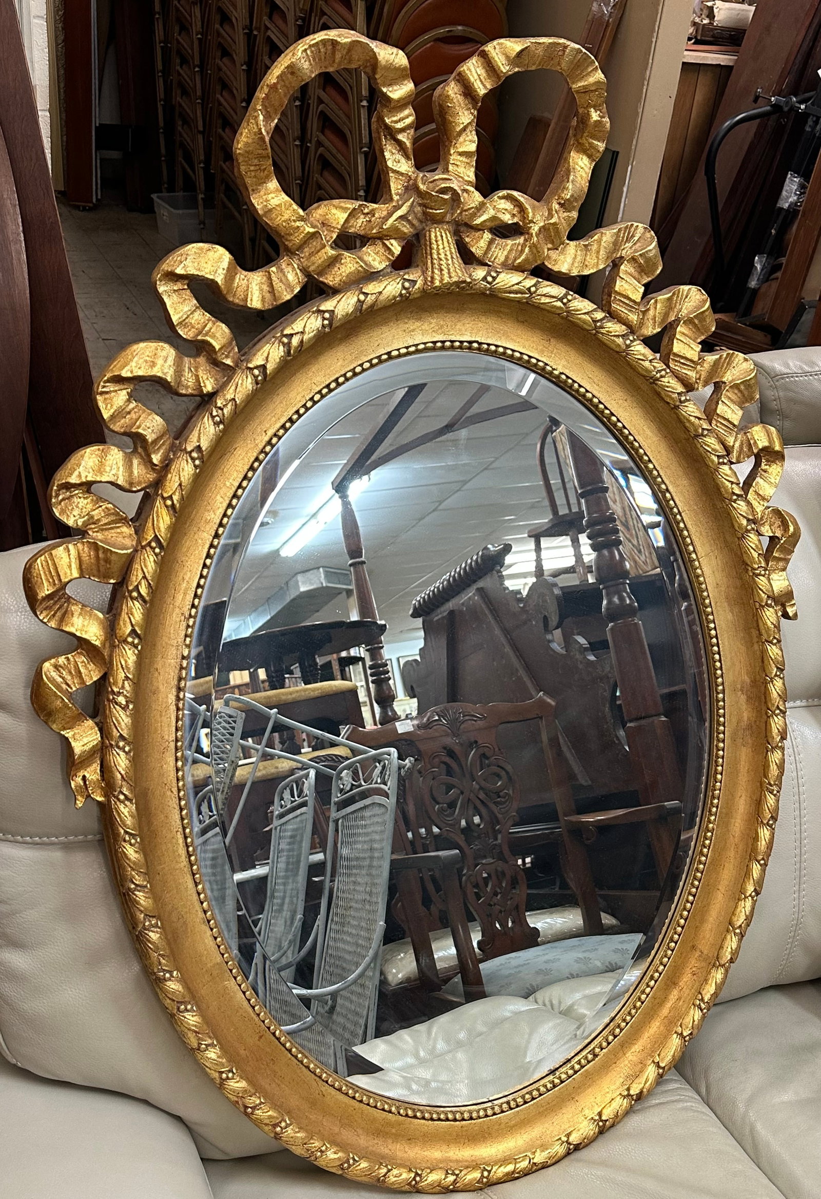 Gilded Frame Oval Bevel Edge Mirror: Gilded Frame Oval Bevel Edge Mirror. 44 1/2" x 32 3/4" "ALL DESCRIPTIONS AND ANY CONDITION STATEMENT GIVEN BY LANGSTON AUCTION GALLERY ARE STRICTLY OPINIONS AND LANGSTON'S SHALL HAVE NO RESPONSIBILITY