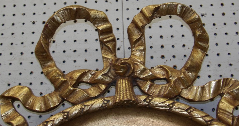 Gilded Frame Oval Bevel Edge Mirror: Gilded Frame Oval Bevel Edge Mirror. 44 1/2" x 32 3/4" "ALL DESCRIPTIONS AND ANY CONDITION STATEMENT GIVEN BY LANGSTON AUCTION GALLERY ARE STRICTLY OPINIONS AND LANGSTON'S SHALL HAVE NO