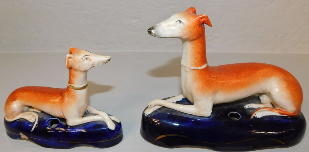 Two Antique Staffordshire Porcelain Whippets: Two Antique Staffordshire Porcelain Whippets . 4 3/4" H 6 1/2" W "ALL DESCRIPTIONS AND ANY CONDITION STATEMENT GIVEN BY LANGSTON AUCTION GALLERY ARE STRICTLY OPINIONS AND LANGSTON'S SHALL HAVE NO