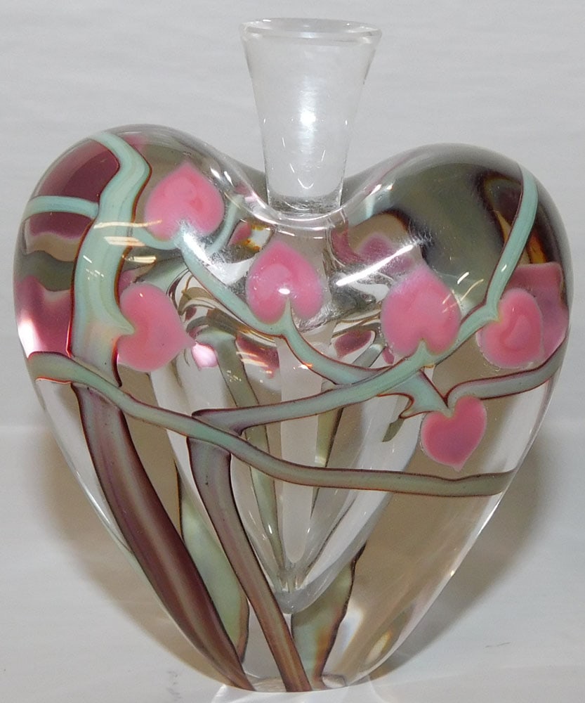 Signed Lalique Heart Formed Scent Bottle: Signed Lalique Heart Formed Scent Bottle . 3" H 2 1/4" W "ALL DESCRIPTIONS AND ANY CONDITION STATEMENT GIVEN BY LANGSTON AUCTION GALLERY ARE STRICTLY OPINIONS AND LANGSTON'S SHALL HAVE NO