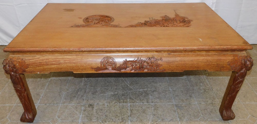 Oriental Carved Teak Wood Cocktail Table by H. Jhangimal & Bros.: Oriental Carved Teak Wood Cocktail Table by H. Jhangimal & Bros.. 20" H 50 1/4" W 32 1/4" D ALL DESCRIPTIONS AND ANY CONDITION STATEMENT GIVEN BY LANGSTON AUCTION GALLERY ARE STRICTLY OPINIONS AND LAN