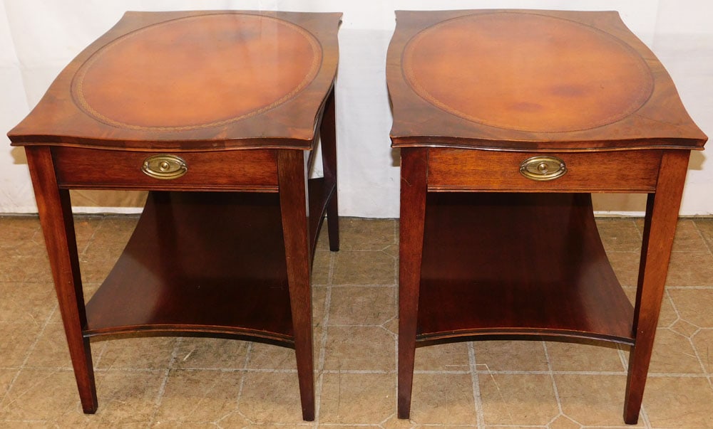 Pair of Mahogany Tooled Leather Top One Drawer Two Tier Tables by Heritage Henredon: Pair of Mahogany Tooled Leather Top One Drawer Two Tier Tables by Heritage Henredon. 23" H 19 1/2" W 26 1/2" D ALL DESCRIPTIONS AND ANY CONDITION STATEMENT GIVEN BY LANGSTON AUCTION GALLERY ARE STRICT