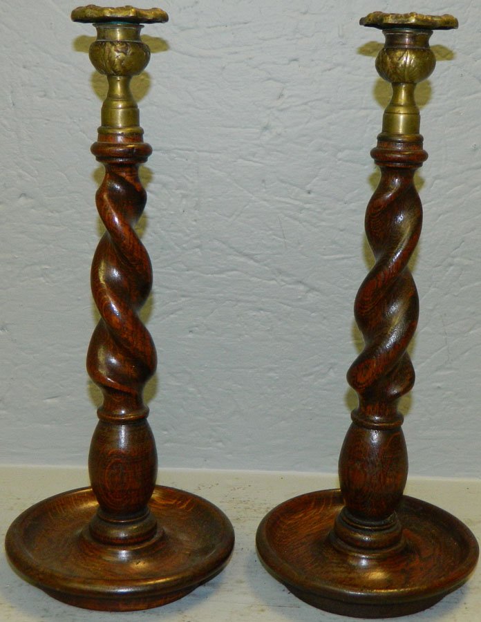 Pair of oak barley twist candlesticks.: Pair of oak barley twist candlesticks.